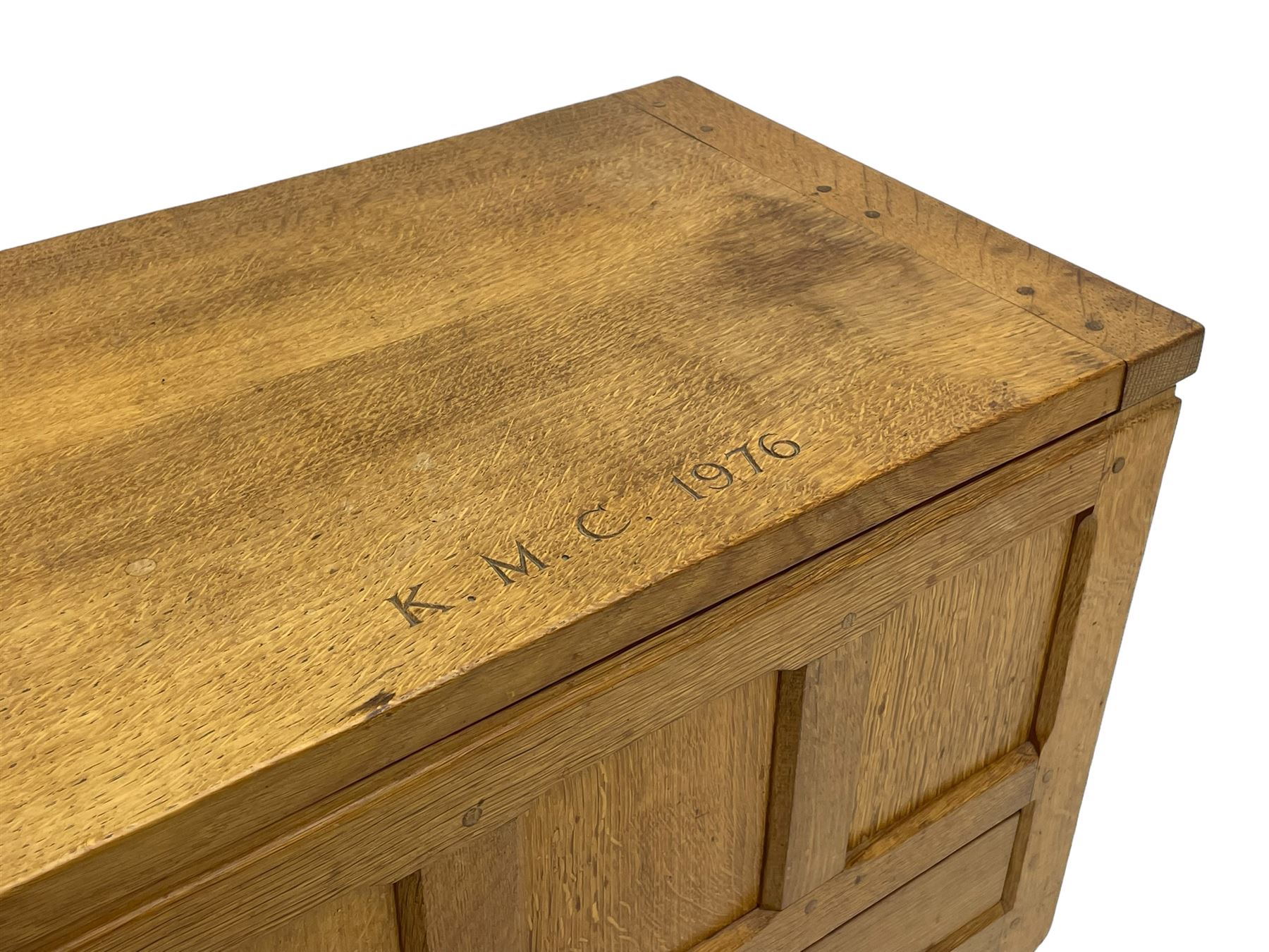 Mouseman - oak work or sewing box, rectangular adzed top inscribed 'L. M. C. 1976' enclosing vacant interior, triple panelled front and double panelled sides, fitted with single drawer, on octagonal supports, carved with mouse signature, by the workshop of Robert Thompson, Kilburn 