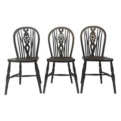 Set of six 19th century elm and ash dining chairs, hoop back with pierced wheel-shaped central splat, shaped saddle seat, raised on turned supports united by H-stretchers