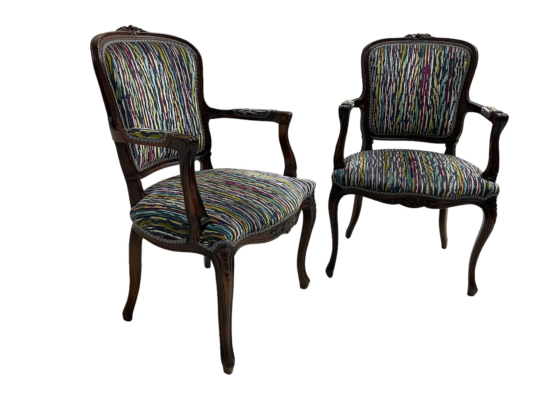 Pair of French design open armchairs, the moulded frame carved with flower heads, upholstered seat, back and arms, on cabriole supports