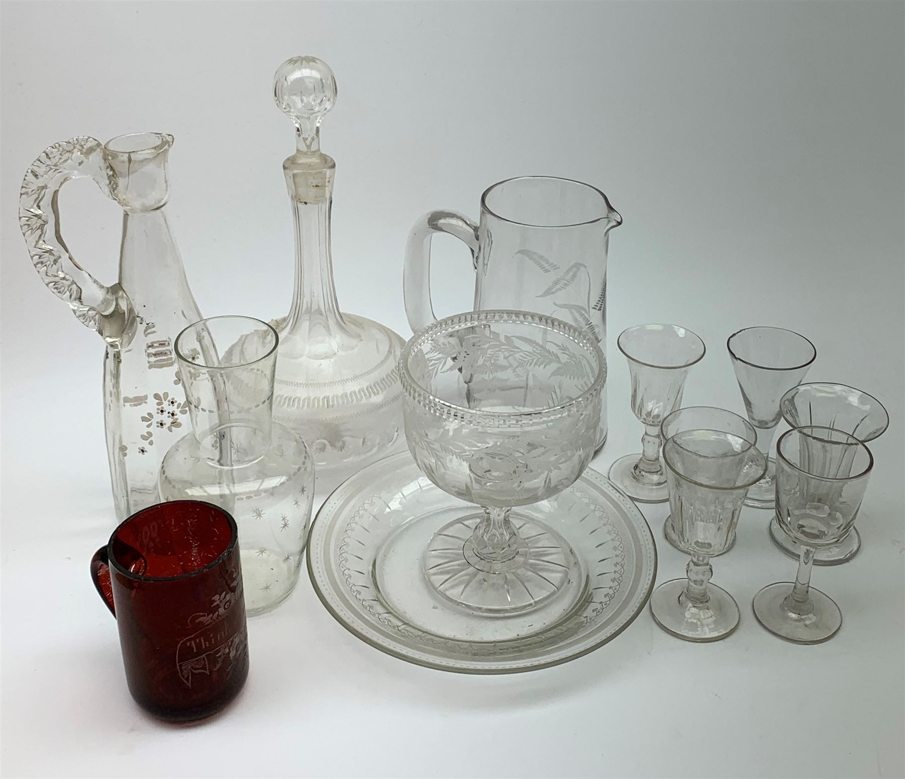 Two early nineteenth century drinking glasses with part fluted bowls and knopped stems, a ruby flashed beaker inscribed Think of me, other Victorian and Edwardian glassware, etc. (13). 