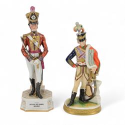 Rudolf Kammer Volkstedt German porcelain figure of a soldier upon an oval base, together w...