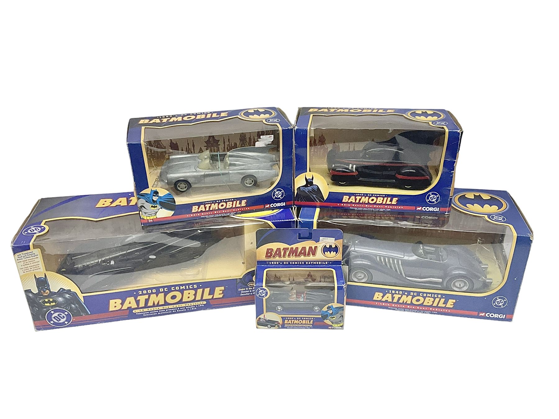 Five Corgi Batmobile die-cast vehicles from the DC Comics collection, to include 1940’s DC Comics BMBV2 1:18 and BMBV1 1:24 scale Batmobiles, all in original boxes 