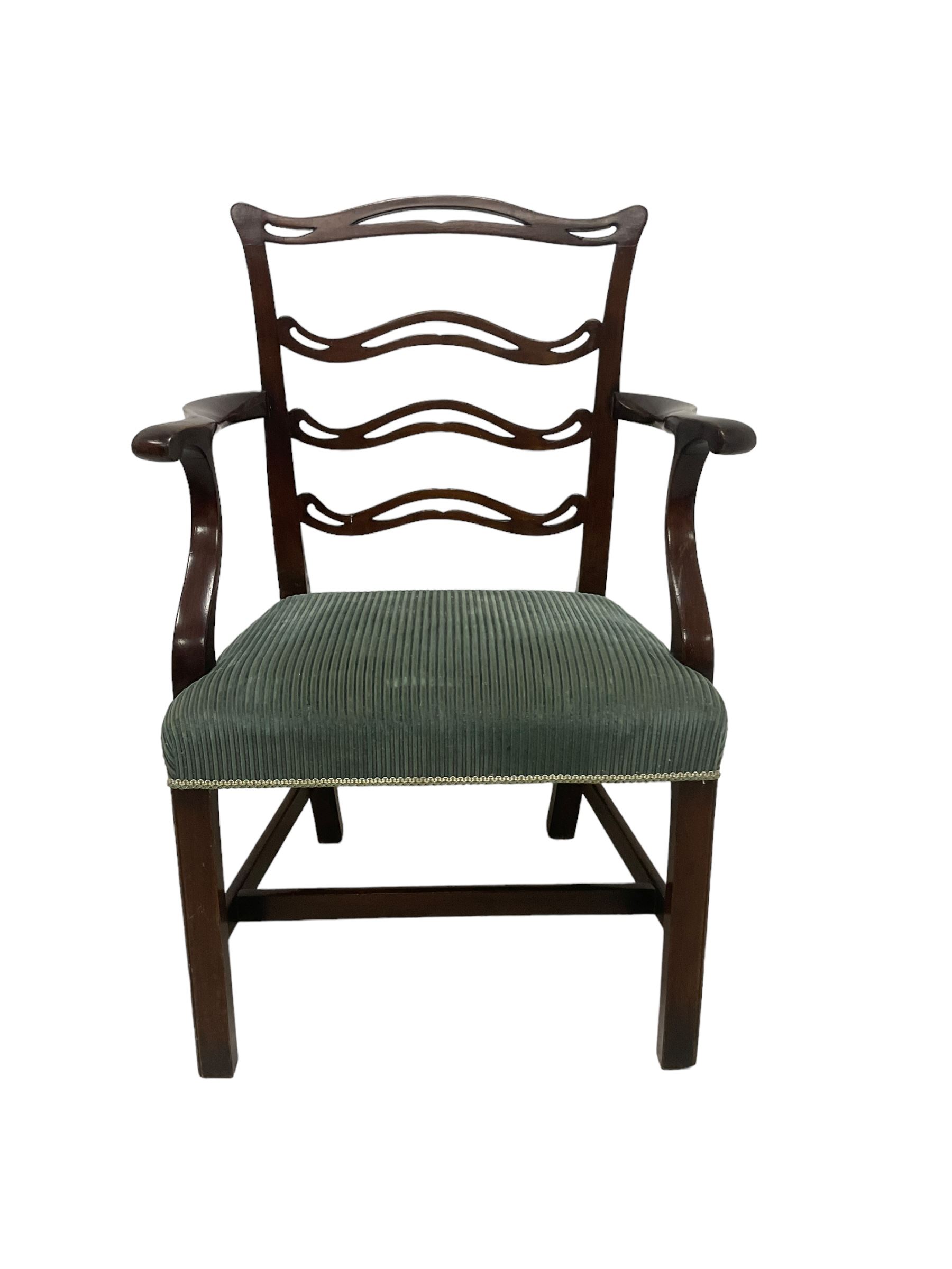 Set of twelve (10+2) Chippendale revival stained beech dining chairs, pierced waived ladder backs with over-stuffed over seats, on square moulded supports joined by stretchers