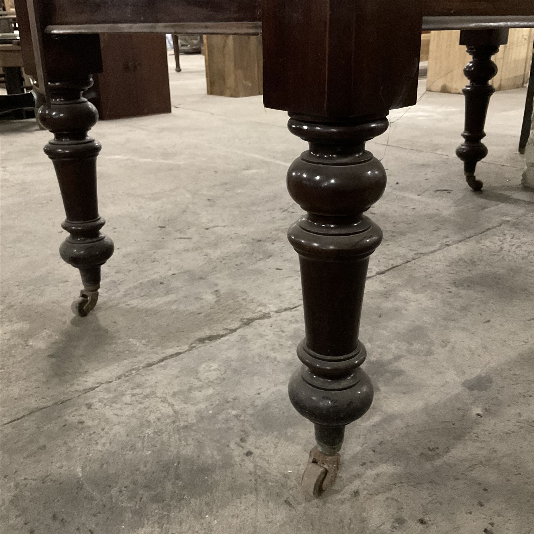 Late 19th century mahogany dining table, moulded rectangular top with canted corners, additional leaf and telescopic extending action, on turned supports with ceramic castors - THIS LOT IS TO BE COLLECTED BY APPOINTMENT FROM THE OLD BUFFER DEPOT, MELBOURNE PLACE, SOWERBY, THIRSK, YO7 1QY