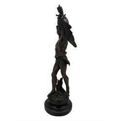 19th century French spelter figure 'Chasseur D'Aigles' on wooden base H48cm and a beaten copper circular tray inscribed with initials D61cm