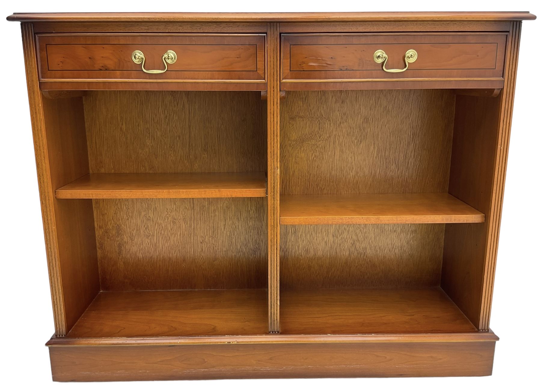 Georgian design yew wood open bookcase, rectangular moulded top over two drawers and two adjustable shelves, on moulded plinth base 