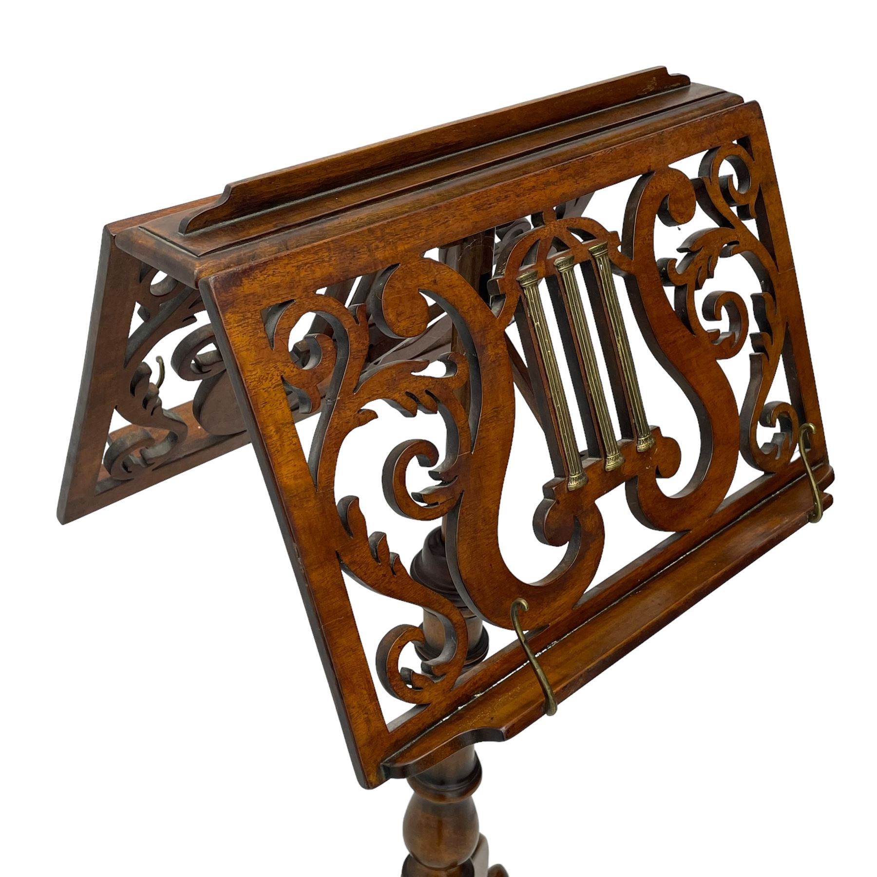 Regency design mahogany duet music stand, double-sided hinged and adjustable reading stands, scrolling leafy branch fretwork with scrolled lyre, fitted with gilt metal reeded columns, on adjustable stem, turned pedestal with tall splayed supports 