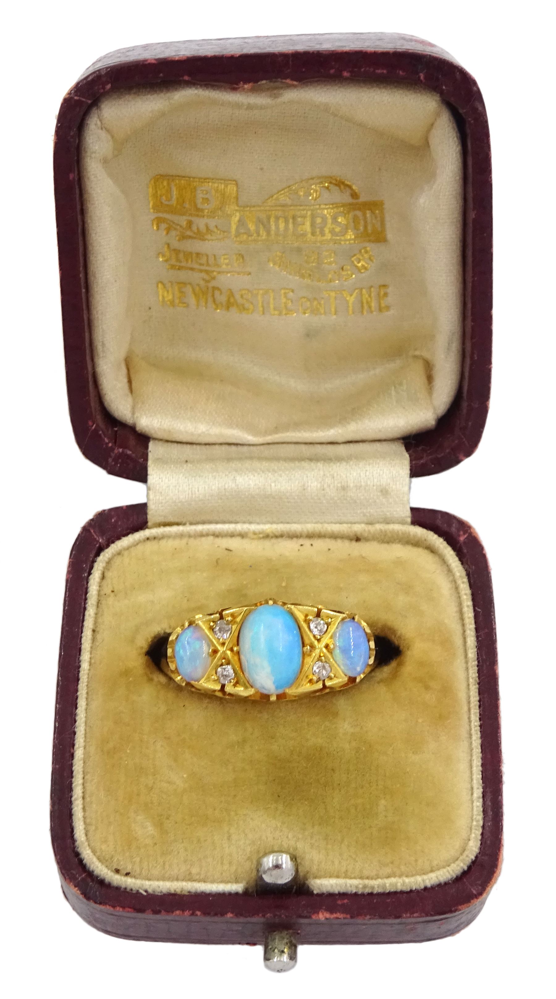 Victorian 18ct gold three stone opal ring, with four diamond accents set between