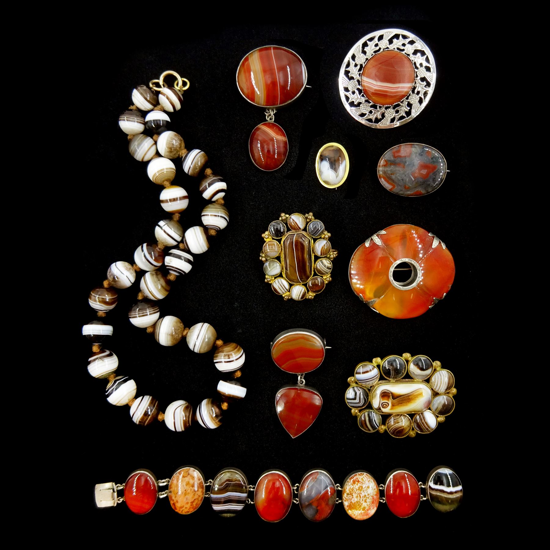 Victorian and later Scottish hardstone and agate jewellery including two gold mounted brooches, silver bracelet, necklace, four silver brooches, one by Ward Bros and two other gilt brooches