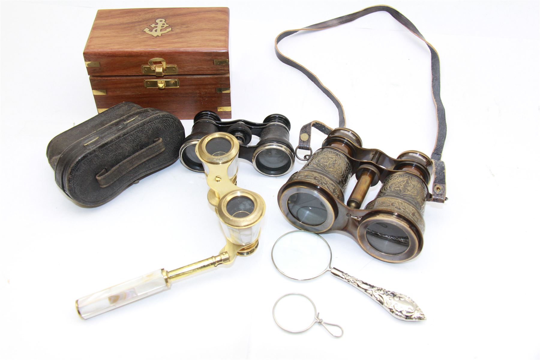 Pair of brass and mother of pearl opera glasses, together with a gilt metal pair of racing binoculars and one other pair, etc 