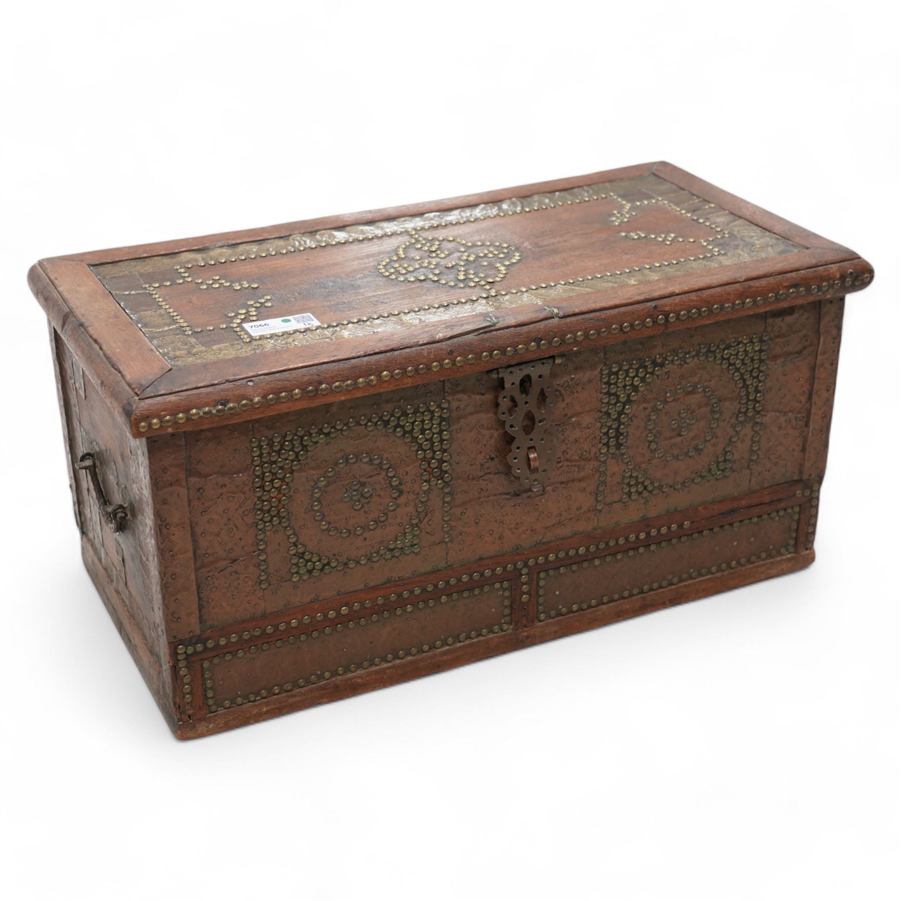 19th century Zanzibar teak and brass mounted chest, hinged lid enclosing divisions, the front decorated with studwork, carrying handles to each side 