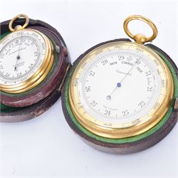 Lowdon Dundee, an early 20th century leather cased pocket barometer with silver dial, D4cm, together with another larger and later example, both cased