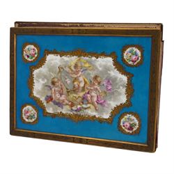 19th century Sevres style porcelain and gilt brass blotter, the rectangular plaque painted with three cherubs in various pursuits, within a gilt floral and scroll border, with four further panels painted with flowers, on a bleu celeste ground, within an engraved gilt brass border, 29cm x 22cm 