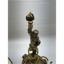 Gilt metal table lamp, modelled as a classical female figure holding the shade aloft in one hand, upon a spreading base, including shade H51cm