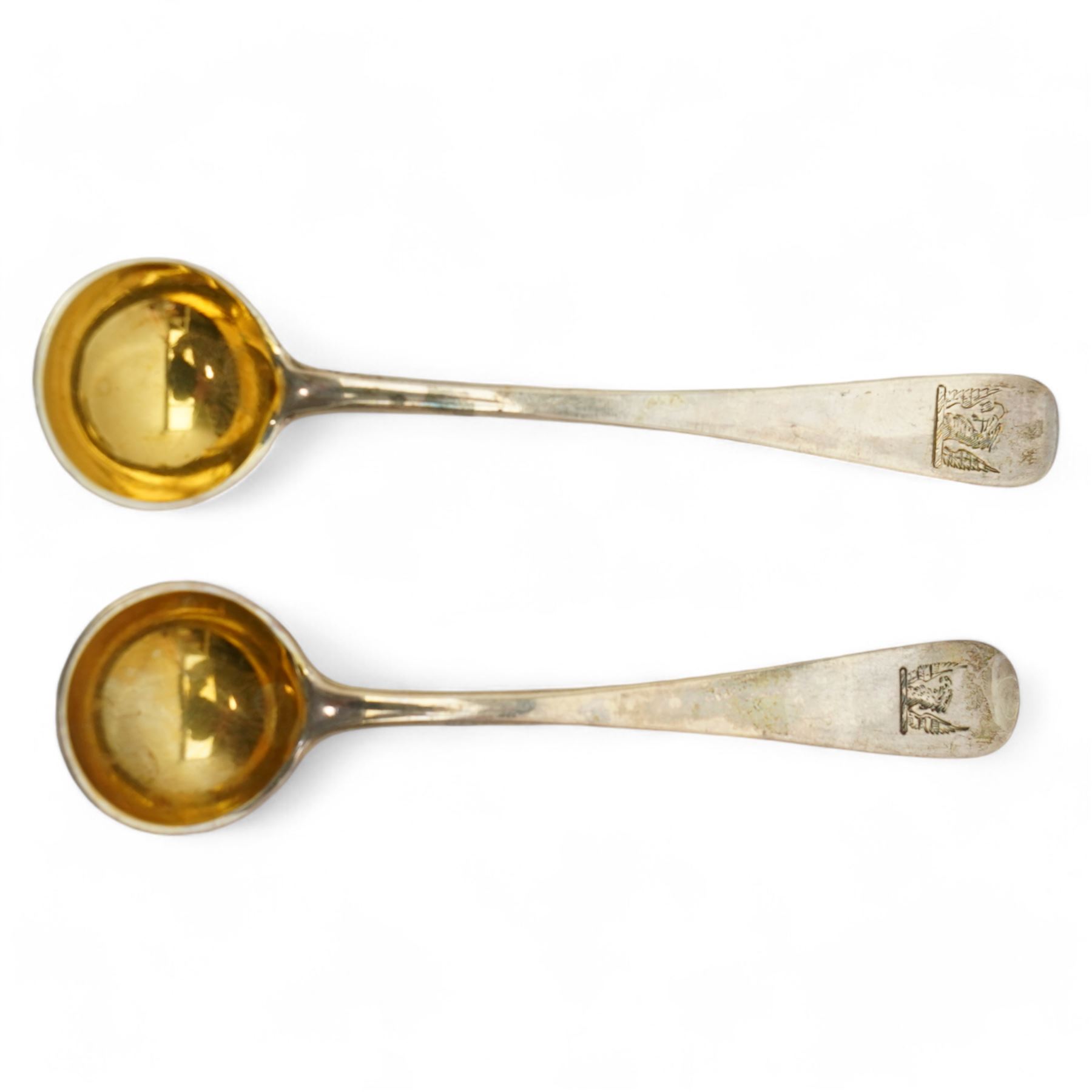 Pair of George III silver salts of elongated oval design with gilded interior and gadrooned border engraved with a monogram, raised on ball feet each 8.5cm x 6cm London 1820 Maker Rebecca Emes and Edward Barnard I together with a pair of later salt spoons