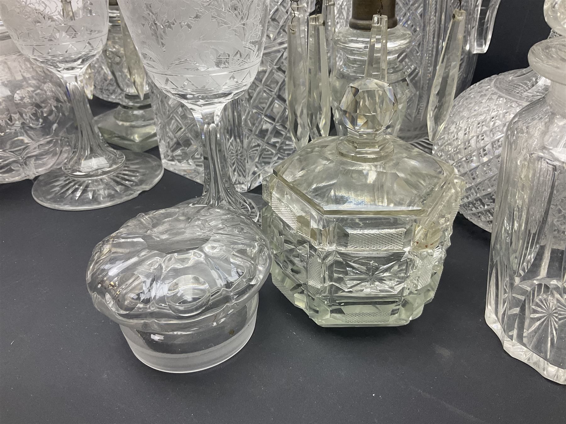 Collection of 18th century and later cut glass, including a pair of Victorian onion shaped decanters with elongated necks and hobnail cut decoration, together with a similar jug, of tapering form with C handle and an Georgian cut glass jug, with stepped decoration to neck and square cut decoration to body, tallest jug H30cm