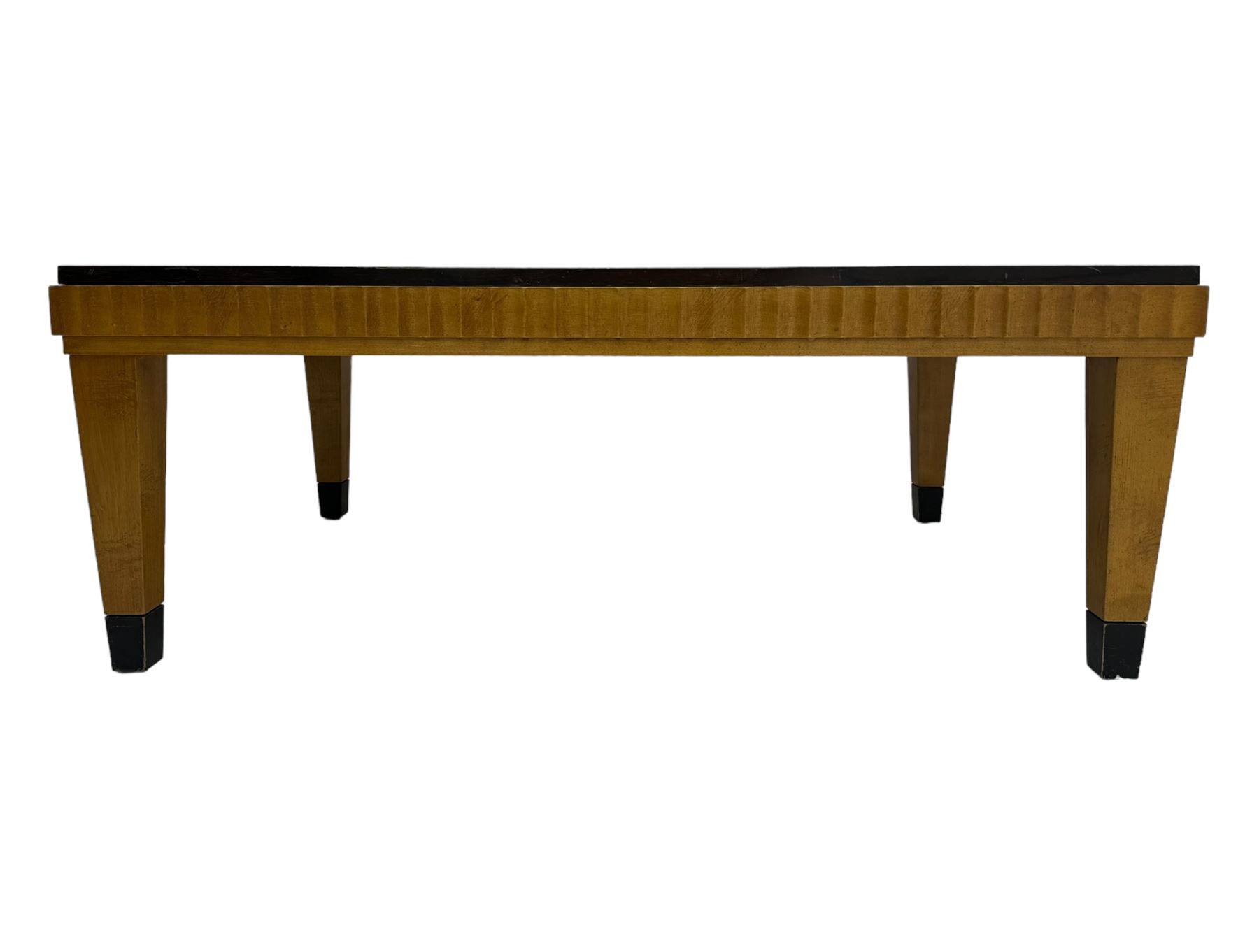 Art Deco design maple wood coffee table, rectangular top with reeded edge, on tapered supports with metal feet protectors