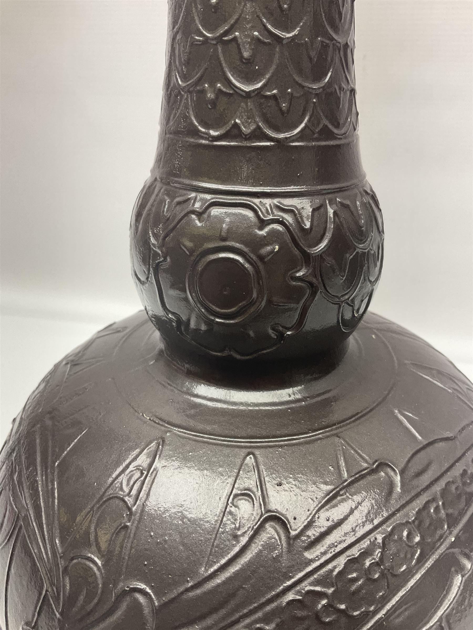 Burmantoft vase with slender neck, tubeline decoration on a brown ground, with impressed mark beneath, H38cm