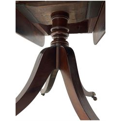 Early 19th century mahogany supper table, rectangular reed moulded drop-leaf top with rounded corners, fitted with single end drawer, on turned pedestal with four out-splayed supports with brass paw castors 