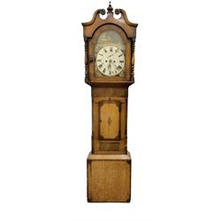 Late 19th century - oak and mahogany 8-day longcase clock, with a swan necked pediment, break arch hood door beneath flanked by ring turned pilasters, trunk with canted corners and a short wavy topped door, on a reduced plinth with no feet, painted dial with a depiction of a huntsman to the arch and game to the spandrels, with brass hands, Roman numerals and matching seconds and date dials, dial pinned directly to a rack striking movement, striking the hours on a bell. With pendulum and two weighs 