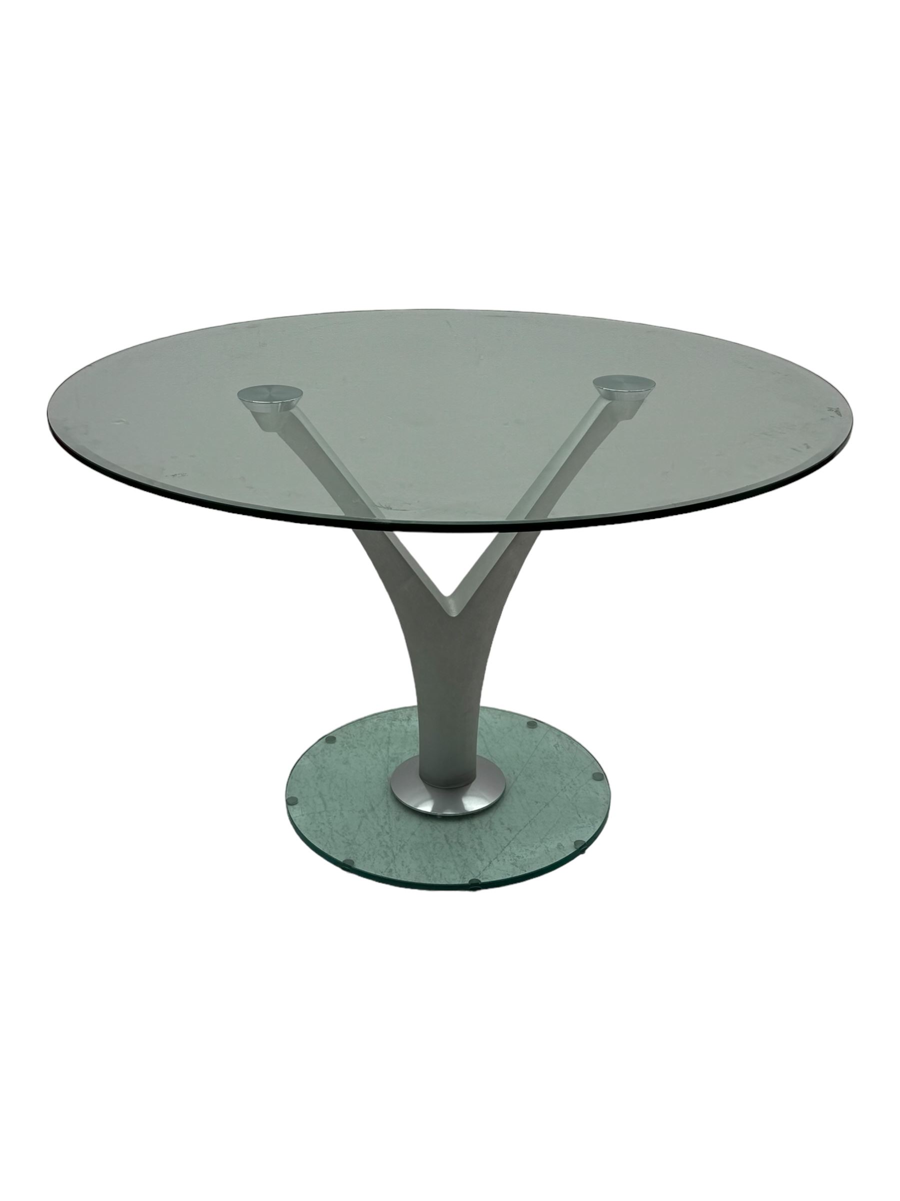 Rolf Benz glass dining table, circular bevelled glass top supported by central Y-shaped brushed metal column, terminating in circular glass base; four red leather tub chairs with curved backrests and vertical stitching, on round chrome feet (5)