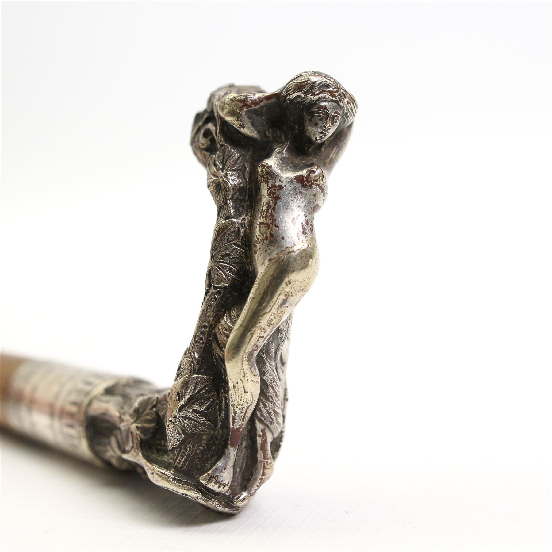 Art Nouveau silver-plated walking cane, the handle depicting a reclining female nude amongst fruiting vines, L87cm 