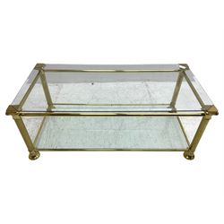 Gilt metal and bevelled glass two-tier coffee table, the faceted supports with Ionic Capitals