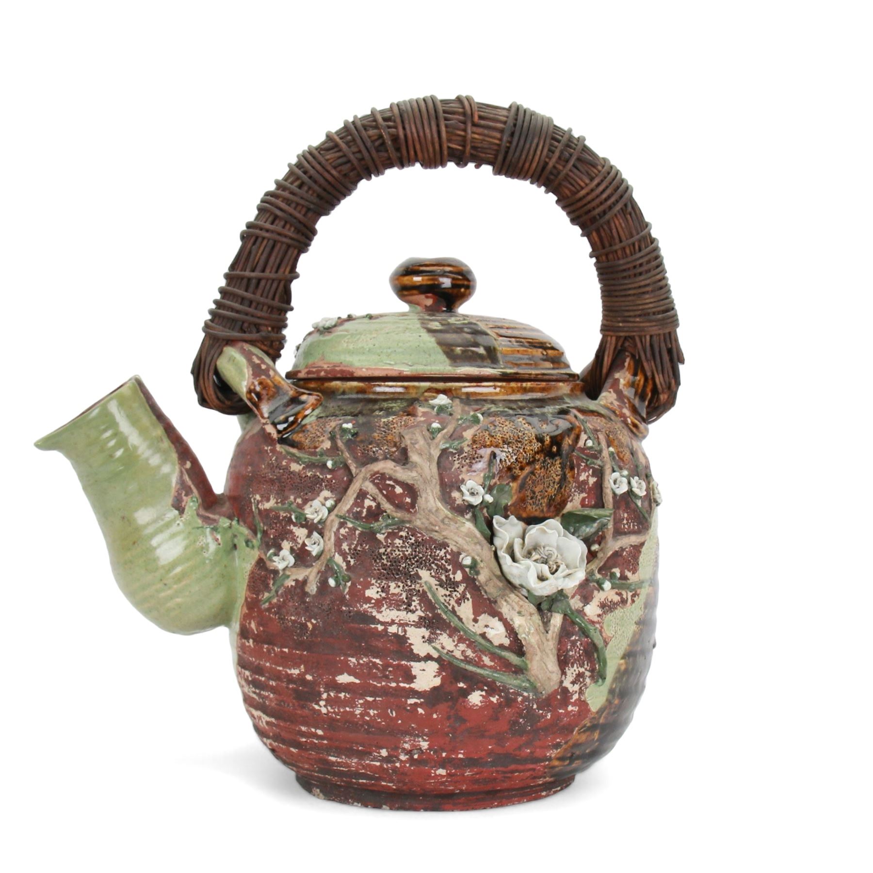 Very large Japanese Shigakari type coil built teapot, the body with a blossoming encrusted tree, woven loop handle and part green glazed spout and cover, H52cm