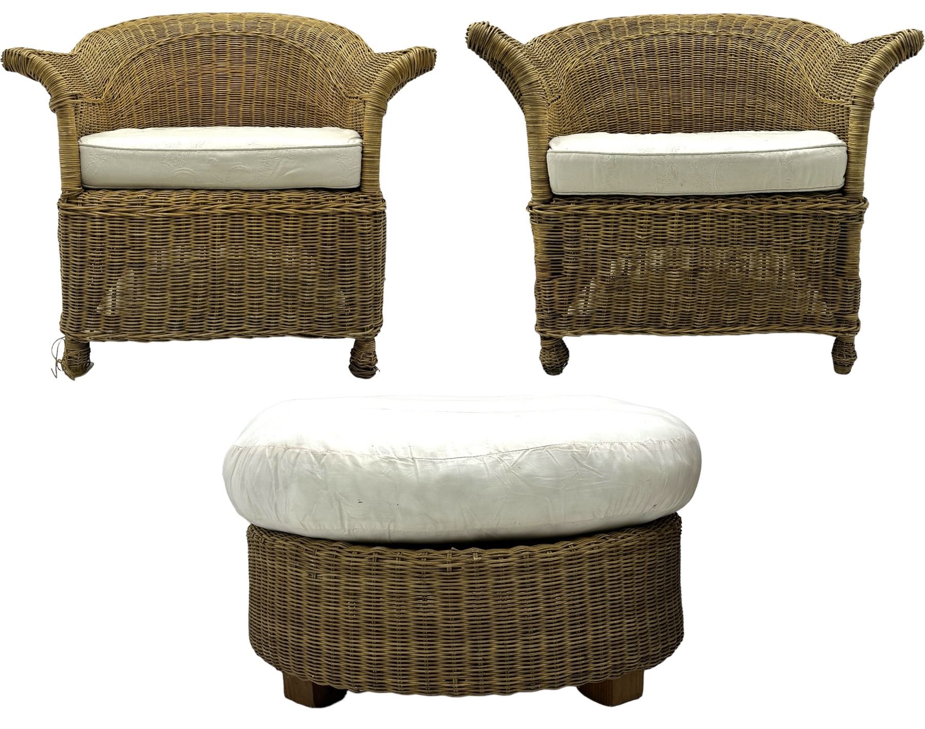 Rattan armchair and ottoman set, pair of armchairs featuring rounded backrests with wide armrests, woven wicker frame with weaving and upholstered seat cushions in off-white fabric with flowing floral pattern (W83 D80 H78cm); matching round ottoman with upholstered cushion on square wooden feet (W65 D65 H37cm)