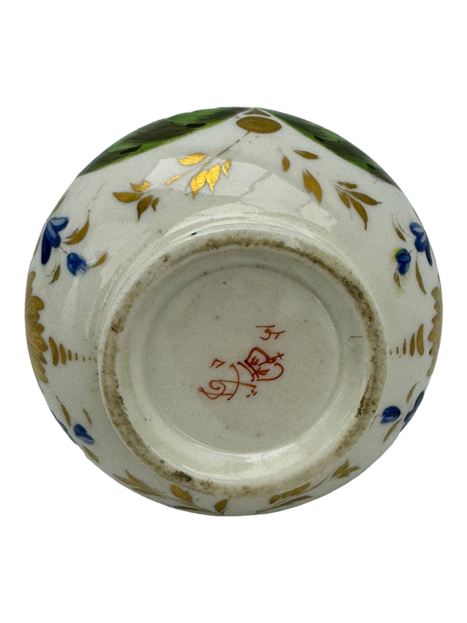 Early 19th century Derby porcelain to include a campana form inkwell, small bottle form vase, twin handled vase and flared rim vase, hand painted with a landscape scene, H10cm (4)