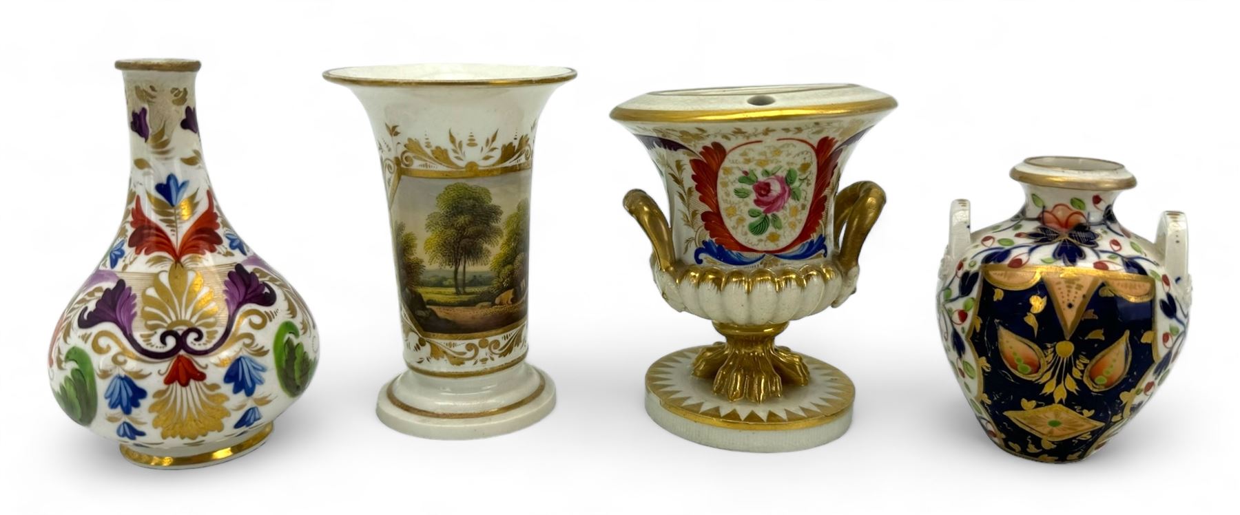 Early 19th century Derby porcelain to include a campana form inkwell, small bottle form vase, twin handled vase and flared rim vase, hand painted with a landscape scene, H10cm (4)