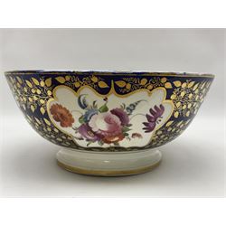 19th century continental bowl, decorated with hand painted floral sprays amongst gilt foliate decoration on a cobalt blue ground, D27.5cm