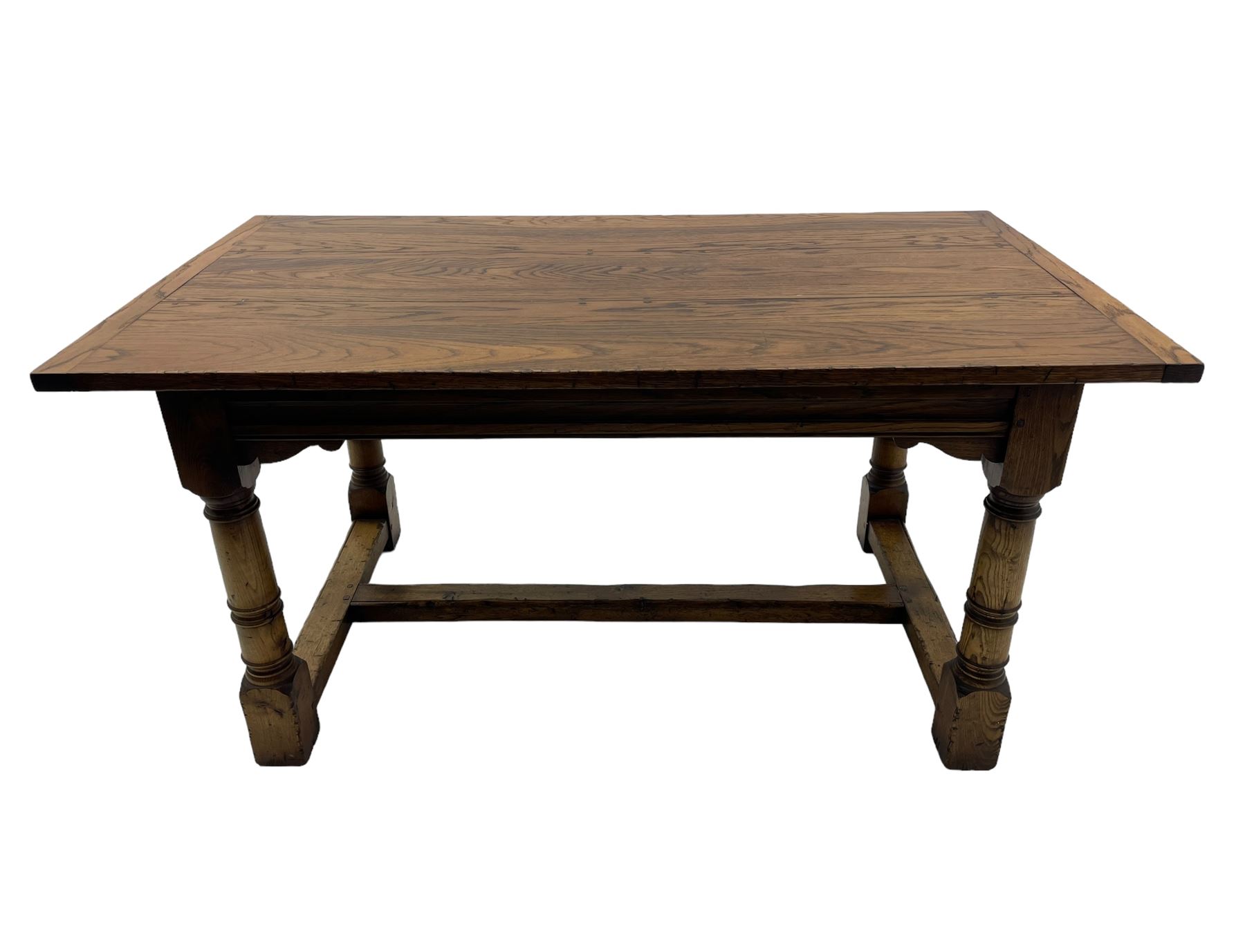 Oak refectory dining table, rectangular three plank top with cleated ends, two additional leaves, on turned supports united by H-stretchers 