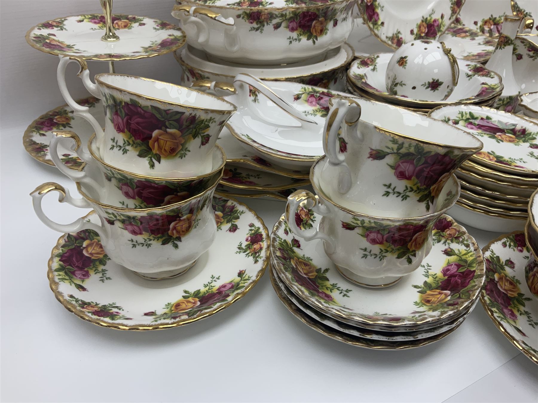 Royal Albert Old Country Roses pattern part tea and dinner service, to include two tureens, eight dinner plates, six side plates, twelve bowls, two mugs, seven teacups and saucers, milk jug,  twelve cake plates, six soup bowls and saucers, candlesticks, etc (95)