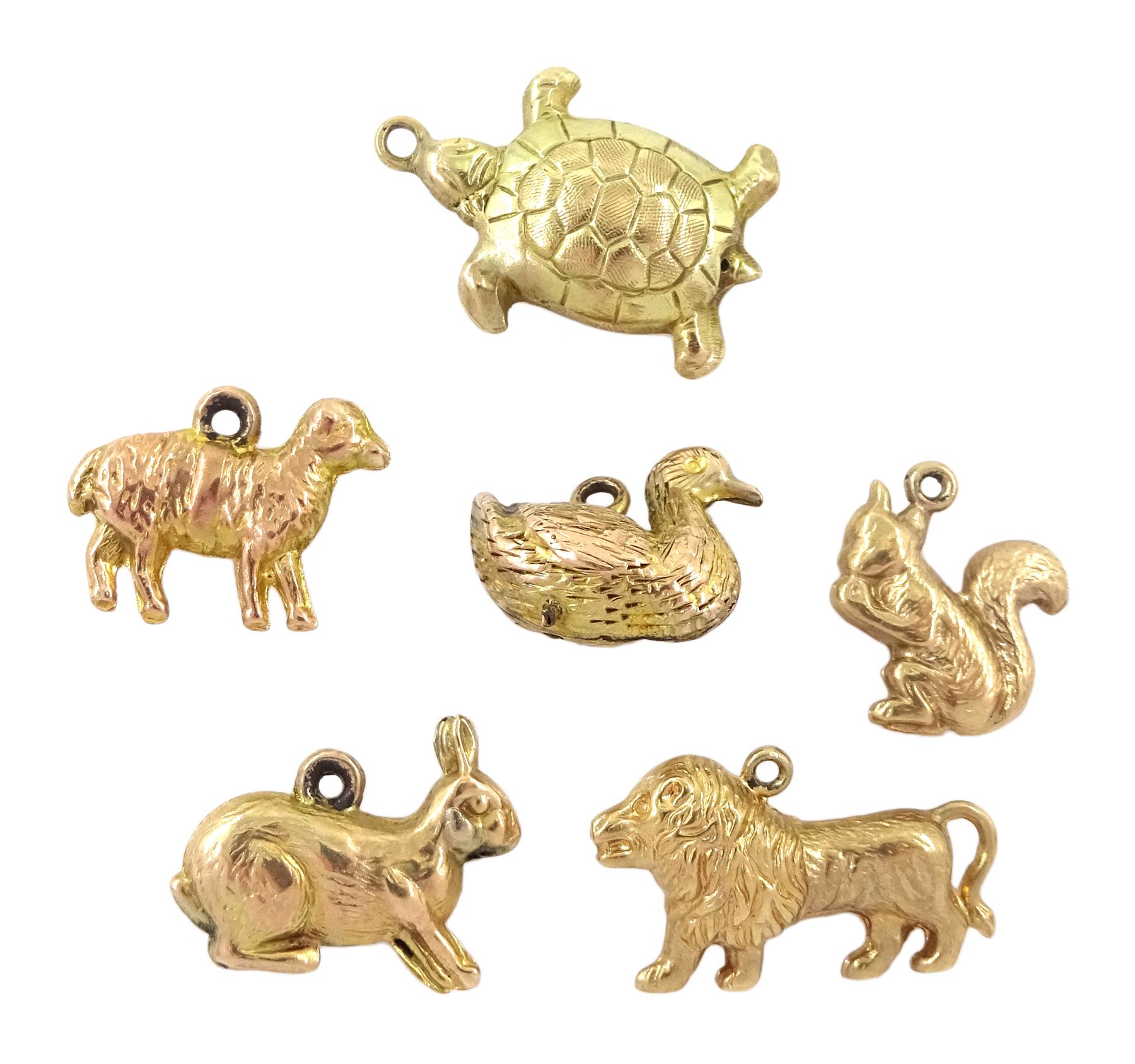 Six 9ct gold pendant / charms including duck, turtle, lion, rabbit, squirrel and sheep