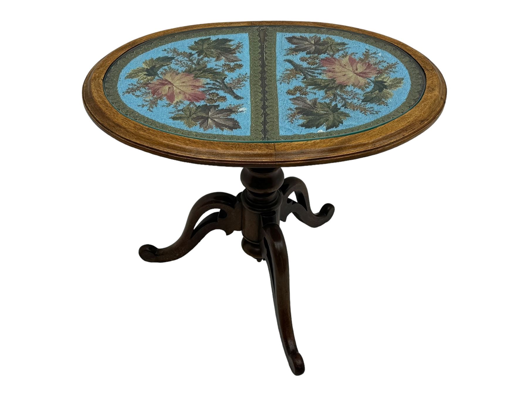 Victorian mahogany pedestal table, oval top inlaid with tapestry under glass, turned central pedestal with pointed finial, on three carved scroll supports