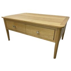 Contemporary light oak rectangular coffee table, fitted with single drawer disguised as two drawers to each side, on tapering supports