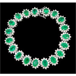 18ct white gold oval emerald and round brilliant cut diamond cluster bracelet, stamped 750, total emerald weight 14.70 carat, total diamond weight 7.24 carat