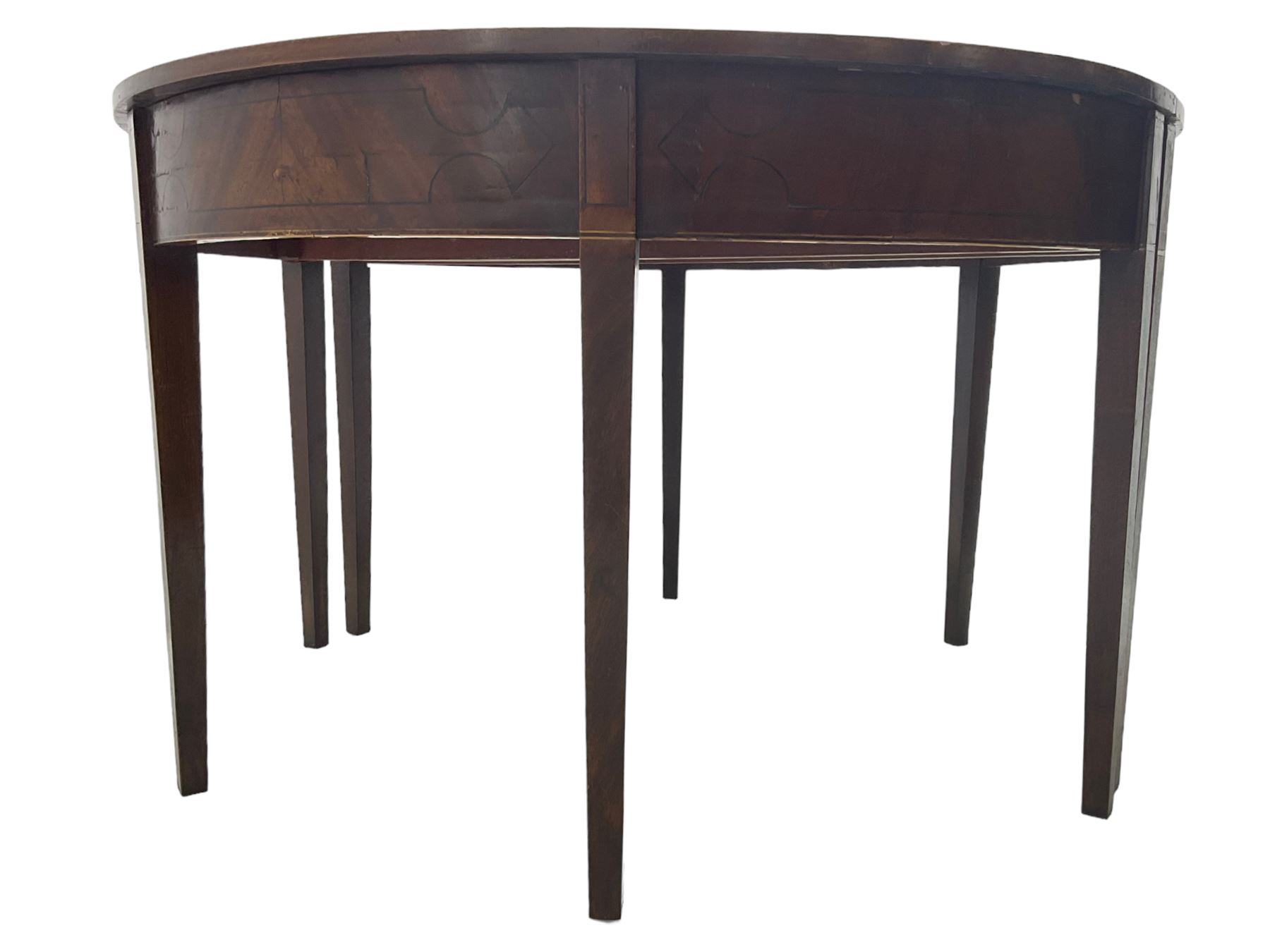 Regency mahogany D-ended extending dining table, circular top with banded fireze inlaid with ebony stringing, raised on square tapering supports, with two additional leaves, supported by gate-leg central action