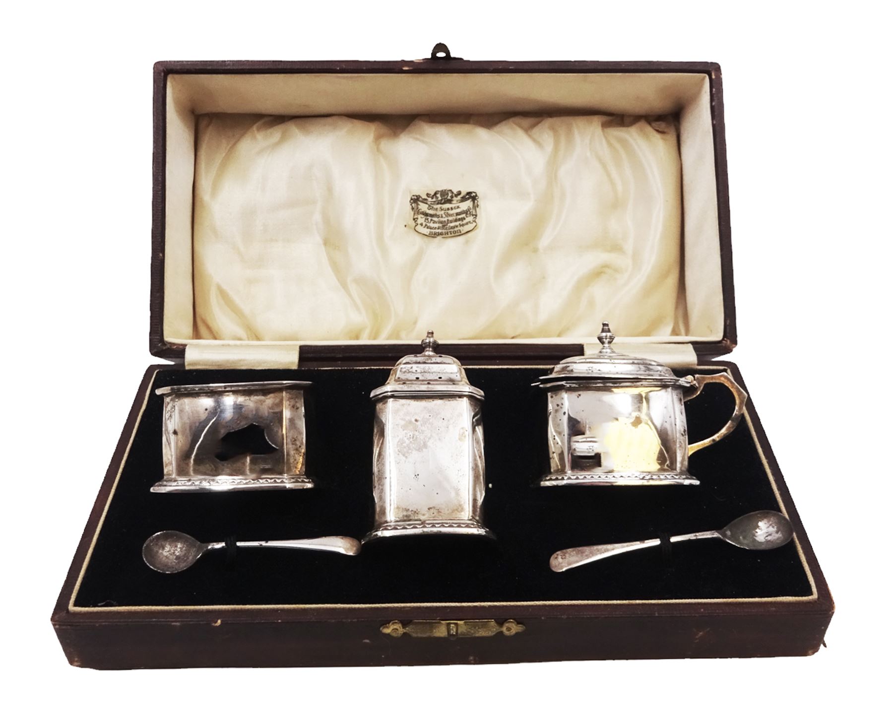 1930s silver three piece cruet set, comprising open salt, pepper and a mustard pot and cover, with two spoons, hallmarked William Neale & Son Ltd, Birmingham 1930, contained with tooled leather fitted case