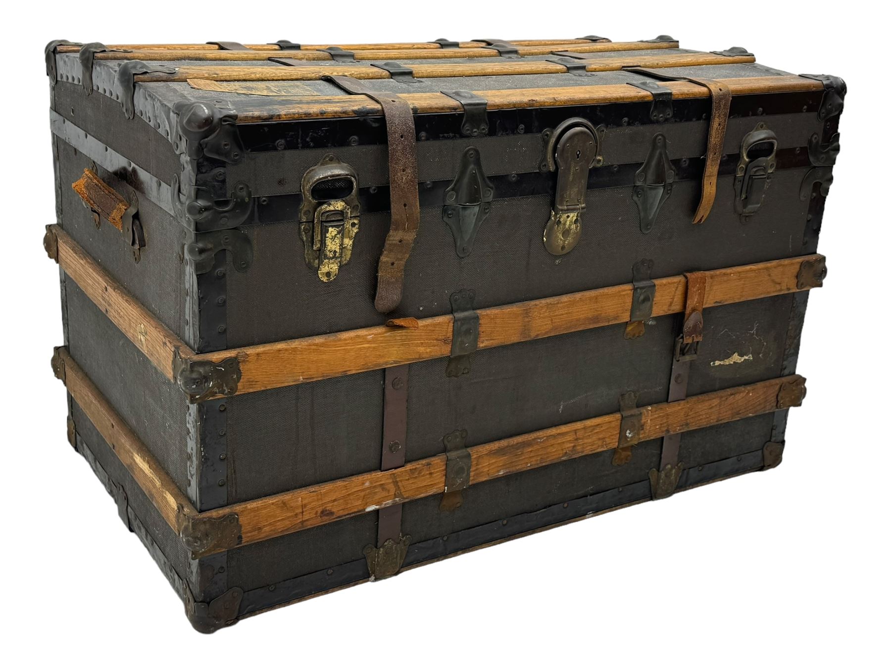 Early 20th century 'McBrine Baggage' steamer trunk, oak frame and black canvas covering, featuring metal hardware and leather straps, fitted with central lock, additional latches, and corner protectors, the interior is lined with floral-patterned paper and includes a removable top tray with makers label 