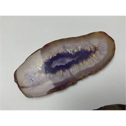 Three purple agate slices, polished with rough edges, of various sizes largest H7cm, L10cm