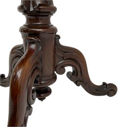 Victorian figured mahogany tripod table, octagonal top with segmented highly figured veneers over pointed arch frieze rails, on turned egg and dart carved pedestal with lappet carved baluster, three splayed and C-scroll carved supports with scrolled terminals