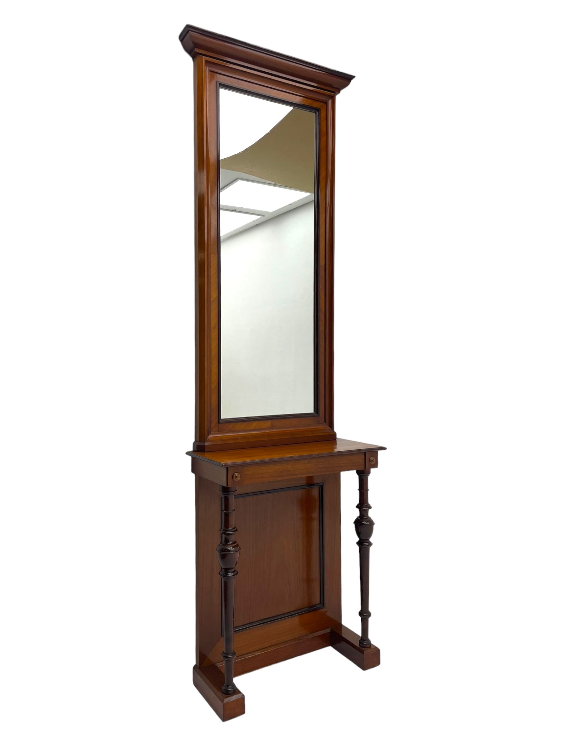 Late 19th to early 20th century walnut hallway console table with pier mirror, tall rectangular mirror with ovolo-moulded cornice, plain mirror plate surrounded by moulded slip and crossbanding, rectangular top over panelled back supports by turned supports, on sledge feet 