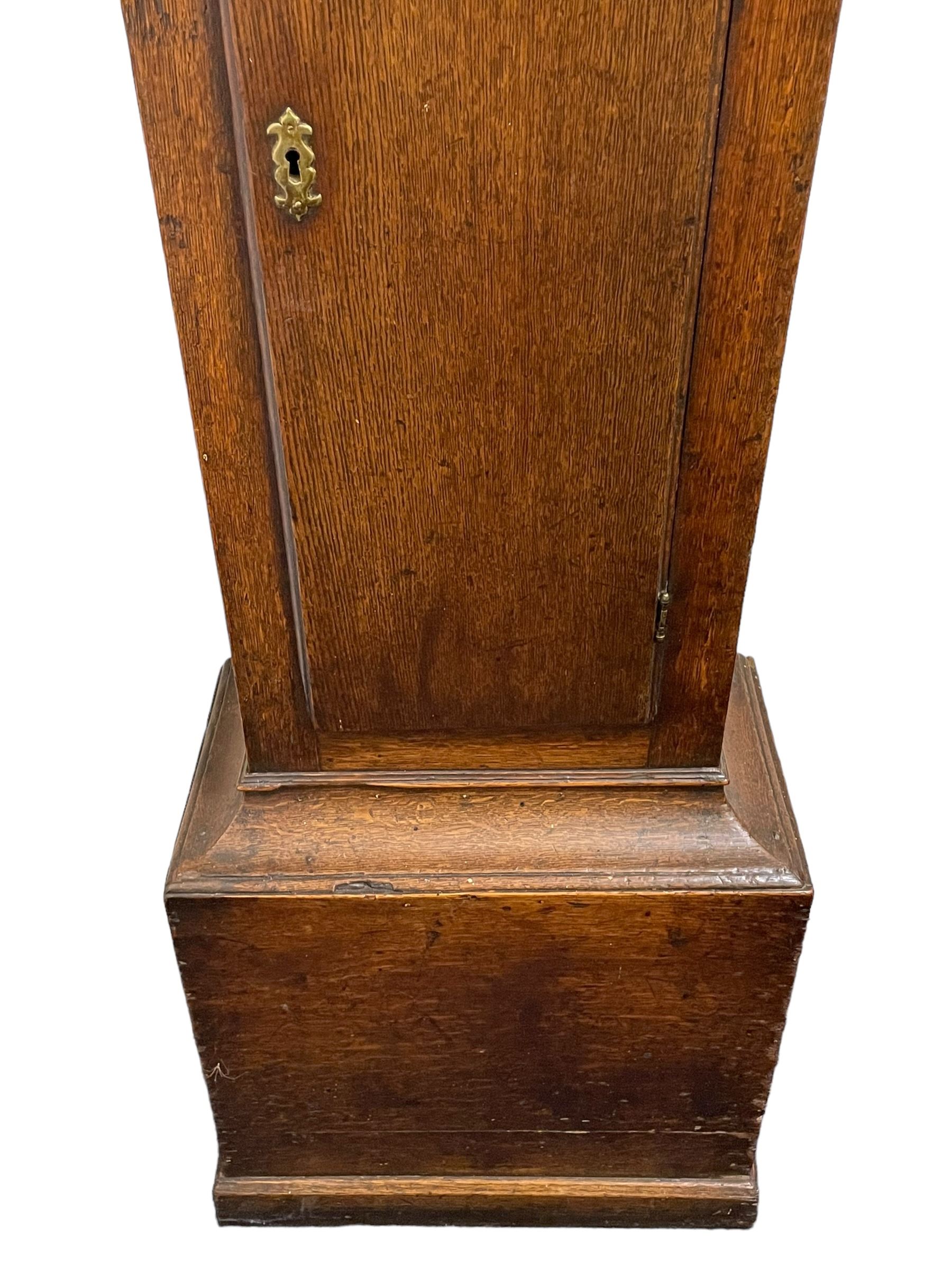 Gilbert Kidd of Malton (North Yorkshire) - late 18th century oak 8-day longcase clock c1780,  with a tall double caddy top and later brass ball and spire finials, break arch hood door beneath with attached pilasters and wooden capitals,  plain trunk with a long flat topped door, raised on a square plinth with applied skirting,  brass break arch dial with the makers name to the silvered boss in the break arch, engraved and silvered dial centre and chapter ring, with cast spandrels and matching steel hands, subsidiary seconds dial and square calendar aperture, dial pinned directly to a rack striking movement with a recoil anchor escapement, sounding the hours on a cast bell. With pendulum and weights.
The Kidd family were a prolific family of provincial clockmakers working in Malton from the mid 18th century until the early 19th century. Many of their clocks are simply signed 