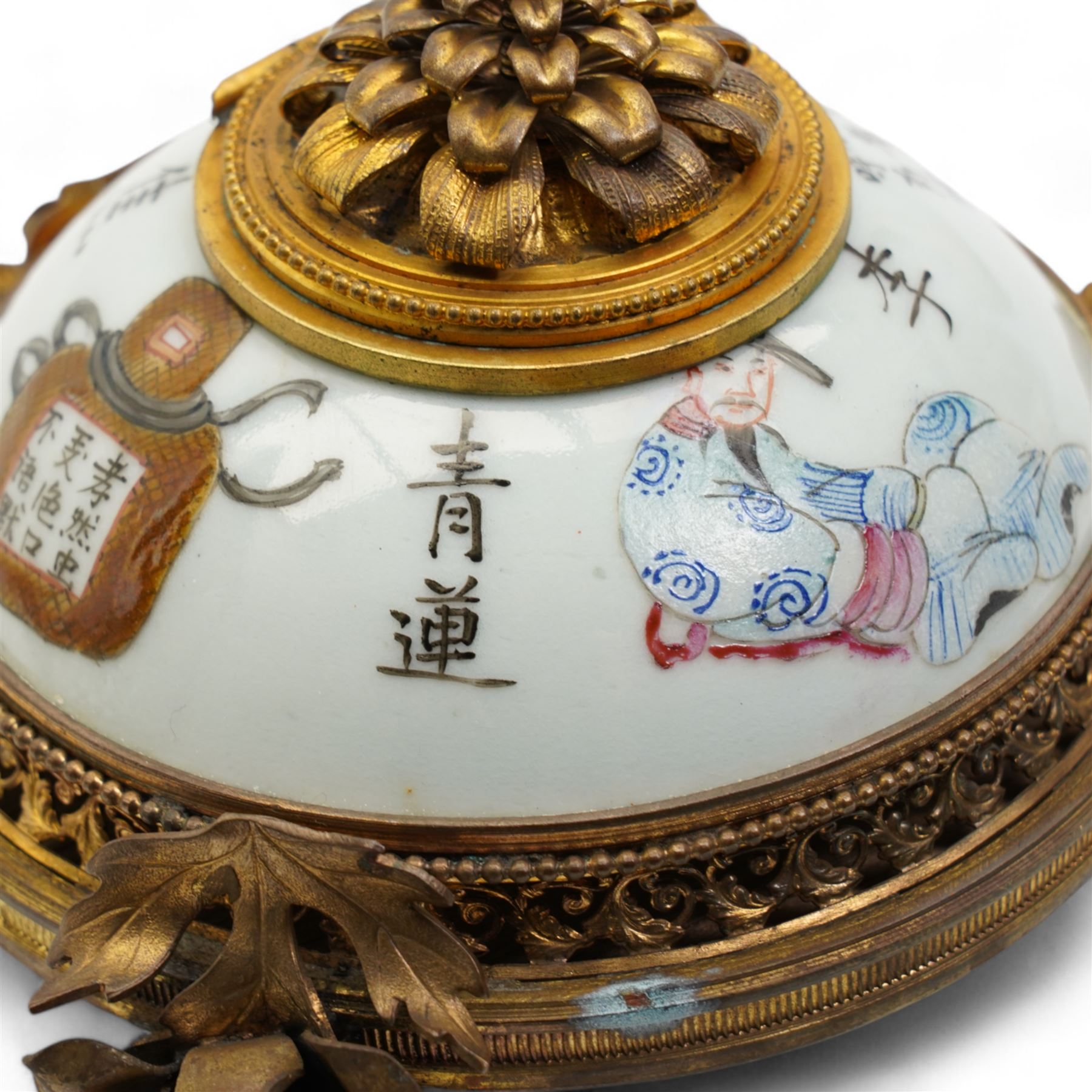 19th century Chinese porcelain famille rose inkwell, painted with figures from the Wu Shuang Pu to include Jiao Xiao Ran and Li Bai, mounted with ormolu style gilt metal mounts, including a floral hinged cover, pierced gallery base, on three rose stem supports, L13cm x H9cm