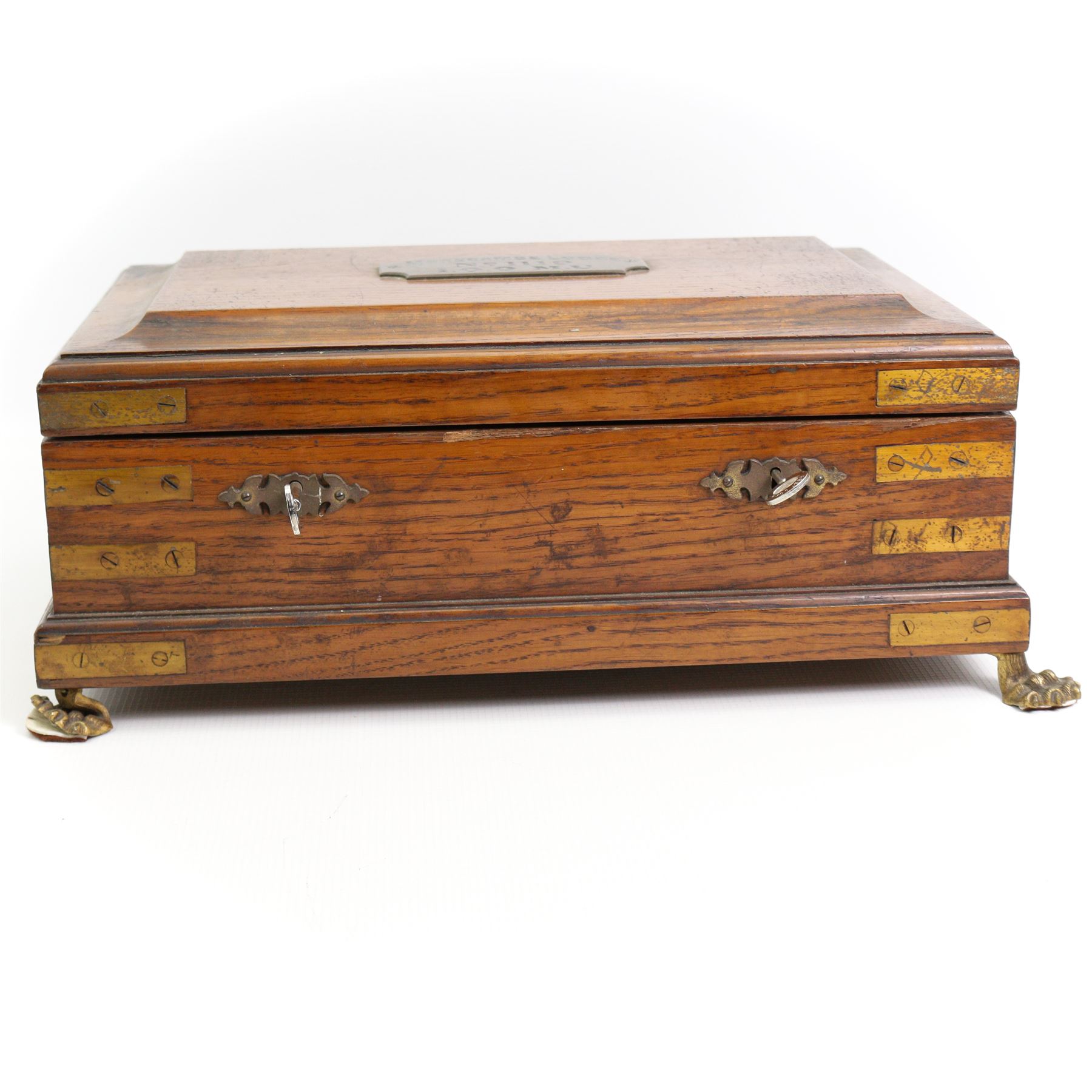 Victorian oak brass bound masonic casket, the cover with plaque engraved 'Morecombe Lodge, No. 1119, 1.0.0. M.U', on four brass lion paw supports, L40cm, H17cm, D30cm