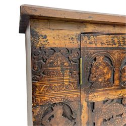 17th century and later cedarwood and pine side cupboard, moulded rectangular top, enclosed by two doors possibly removed and reused from a Venetian Cassone, carved and decorated with penwork, the upper architectural arcade with busts of noblemen, the larger decoration depicting hunters on horseback within woodland landscape with various animals, central and flanking uprights decorated with classical female figures upon pedestals, lower roundels decorated with lion and putto motifs, overall foliate decoration, raised on five hairy paw carved feet, the interior fitted with shelf