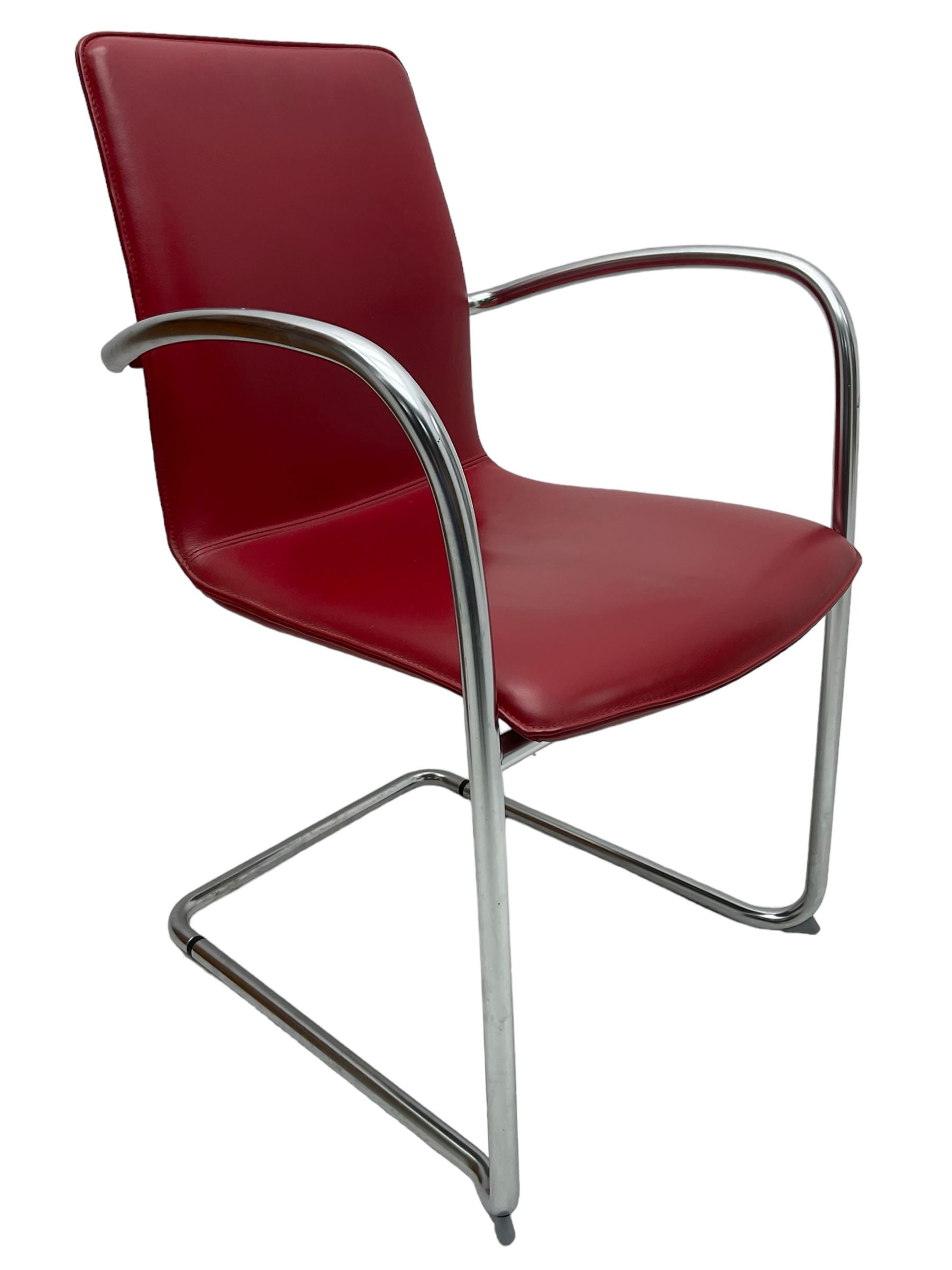 Kusch & Co - contemporary chrome framed armchair upholstered in red leather