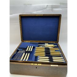 Walker & Hall canteen of plated cutlery for for twelve place settings, all knives with ivory effect handles, within an oak canteen case with a brass shield to the lid, with key, case  